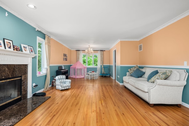 11C Piping Rock Dr, Ossining, NY 10562 - living room with a chandelier, wood finished floors, crown molding, baseboards, and a high end fireplace