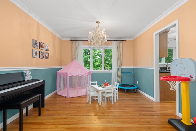 11C Piping Rock Dr, Ossining, NY 10562 - playroom featuring crown molding, a chandelier, wood finished floors, and baseboards