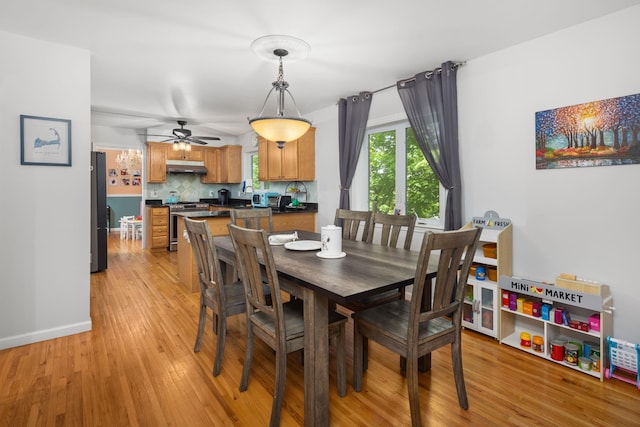 11C Piping Rock Dr, Ossining, NY 10562 - dining area with light wood-style floors, a ceiling fan, and baseboards
