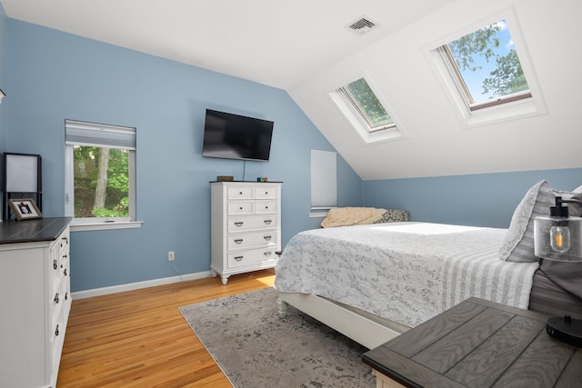 11C Piping Rock Dr, Ossining, NY 10562 - bedroom featuring a skylight, light wood-style flooring, lofted ceiling, and baseboards