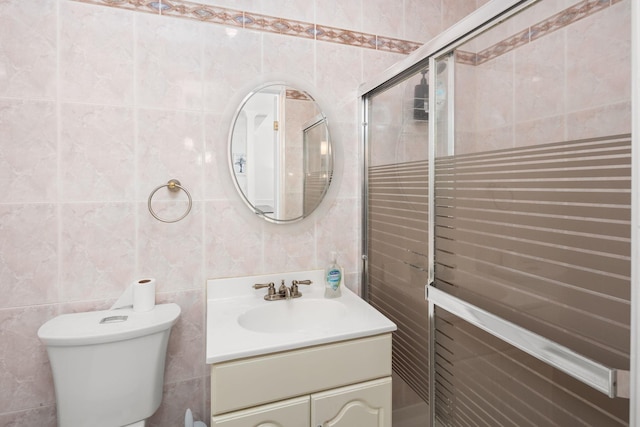 11C Piping Rock Dr, Ossining, NY 10562 - full bath with tile walls, vanity, toilet, and tiled shower