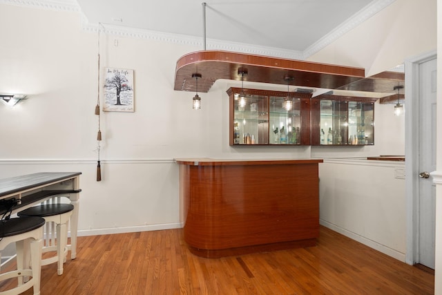 11C Piping Rock Dr, Ossining, NY 10562 - bar with wood finished floors, crown molding, and baseboards