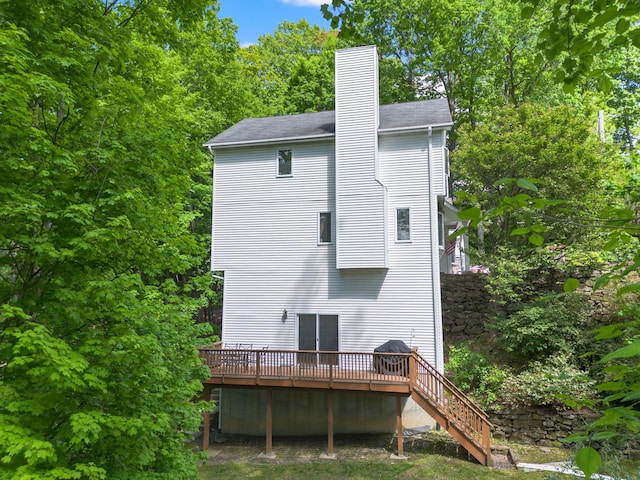 11C Piping Rock Dr, Ossining, NY 10562 - back of house featuring a wooden deck, a chimney, and stairs
