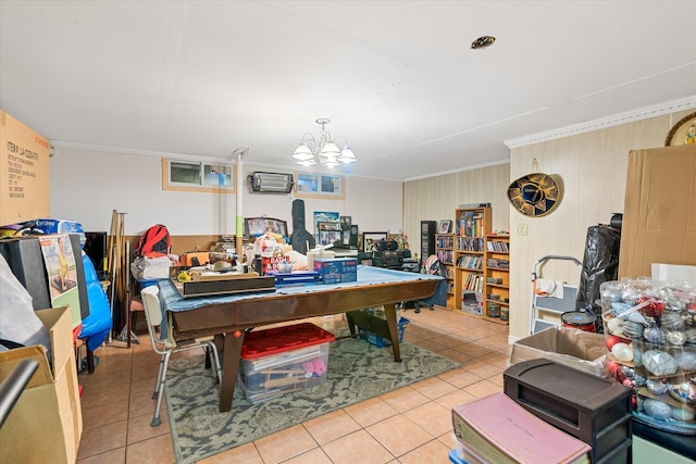 recreation room featuring tile patterned floors, a chandelier, crown molding, and a wall mounted air conditioner