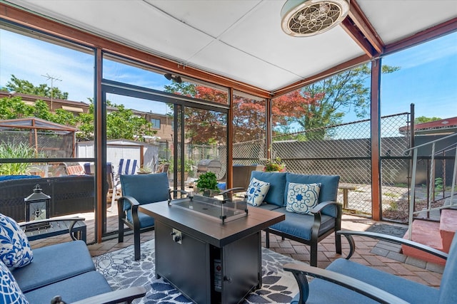 sunroom featuring an outdoor living space