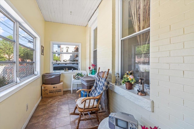 477 Berriman St, Brooklyn, NY 11208 - sunroom / solarium with tile patterned flooring, baseboards, and wooden ceiling