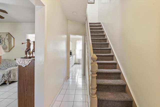 477 Berriman St, Brooklyn, NY 11208 - stairs featuring tile patterned flooring, ceiling fan, baseboards, and radiator