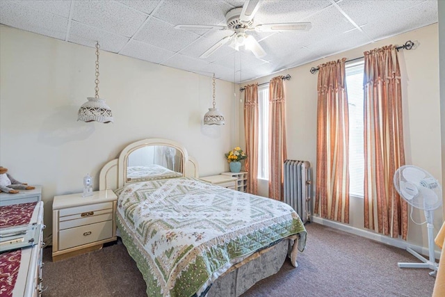 477 Berriman St, Brooklyn, NY 11208 - carpeted bedroom with radiator, a paneled ceiling, baseboards, and ceiling fan