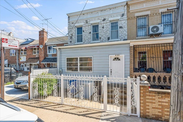 477 Berriman St, Brooklyn, NY 11208 - view of property featuring a fenced front yard and ac unit