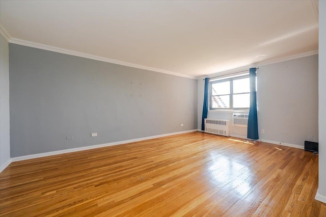 85-10 151st Ave Unit 5E, Howard Beach, NY 11414 - unfurnished room with radiator heating unit, light wood-style floors, baseboards, and ornamental molding