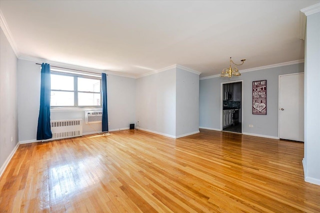 85-10 151st Ave Unit 5E, Howard Beach, NY 11414 - unfurnished room featuring radiator, a chandelier, light wood finished floors, ornamental molding, and baseboards