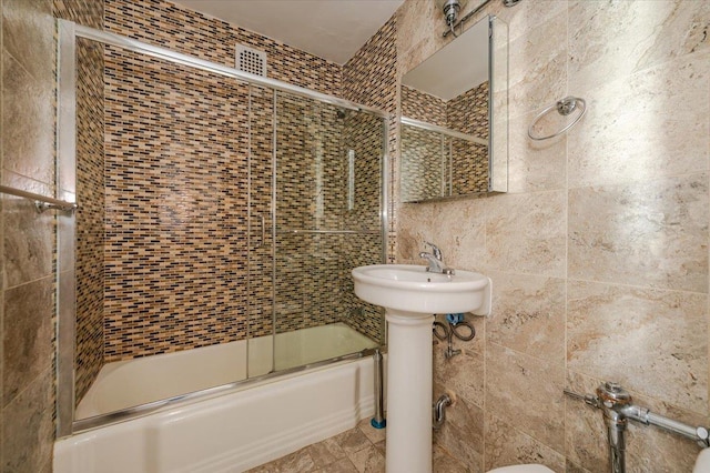 85-10 151st Ave Unit 5E, Howard Beach, NY 11414 - full bath featuring tile walls, enclosed tub / shower combo, and a sink