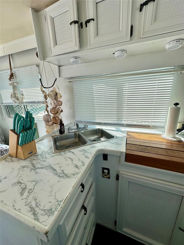 360 Bch 59th St Unit C2Dock, Arverne, NY 11692 - kitchen with a sink, light countertops, and white cabinetry