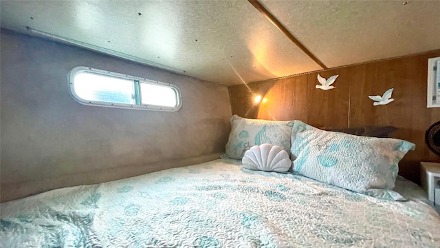 360 Bch 59th St Unit C2Dock, Arverne, NY 11692 - bedroom featuring wooden walls and a textured ceiling