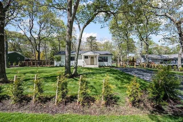 10 Shinnecock Ln, Hampton Bays, NY 11946 - view of green lawn with entry steps