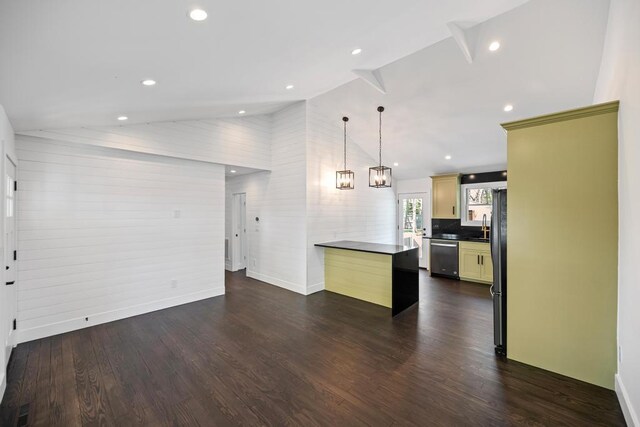 10 Shinnecock Ln, Hampton Bays, NY 11946 - kitchen with stainless steel dishwasher, dark countertops, a sink, dark wood-style flooring, and freestanding refrigerator