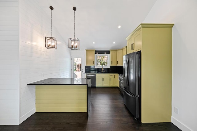 10 Shinnecock Ln, Hampton Bays, NY 11946 - kitchen featuring appliances with stainless steel finishes, dark countertops, dark wood-style floors, a chandelier, and recessed lighting