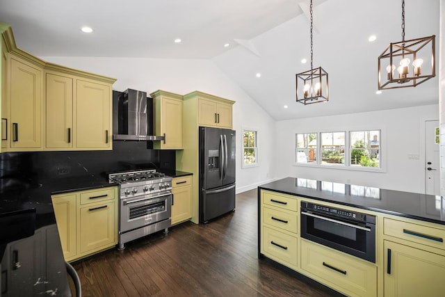 10 Shinnecock Ln, Hampton Bays, NY 11946 - kitchen with refrigerator with ice dispenser, high end stainless steel range, wall chimney range hood, cream cabinets, and oven