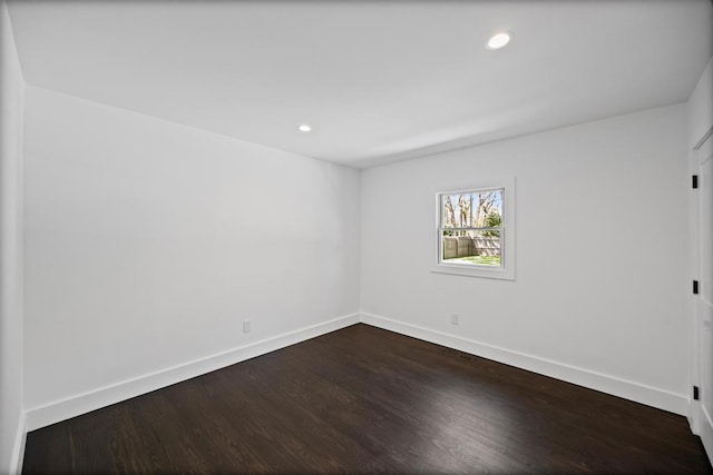 10 Shinnecock Ln, Hampton Bays, NY 11946 - empty room featuring baseboards, dark wood-style flooring, and recessed lighting
