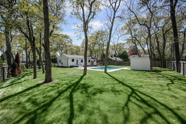 10 Shinnecock Ln, Hampton Bays, NY 11946 - view of yard with an outdoor structure and a storage shed