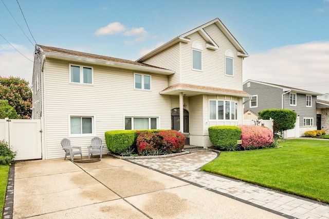 251 N Idaho Ave, Massapequa, NY 11758 - split level home with a gate and a patio