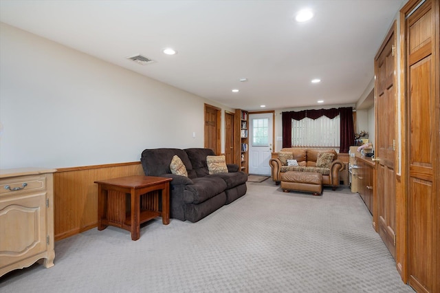 251 N Idaho Ave, Massapequa, NY 11758 - living room with recessed lighting, light carpet, wainscoting, and wooden walls