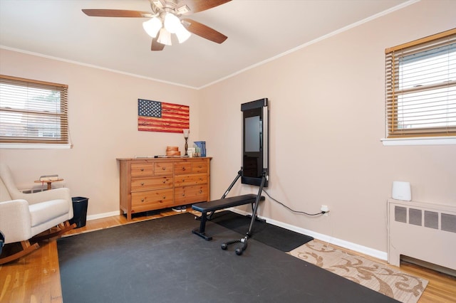 251 N Idaho Ave, Massapequa, NY 11758 - sitting room featuring radiator heating unit, ceiling fan, baseboards, wood finished floors, and ornamental molding