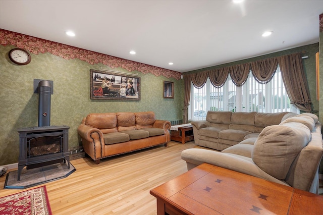 251 N Idaho Ave, Massapequa, NY 11758 - living area with light wood-style flooring, wallpapered walls, a wood stove, and recessed lighting
