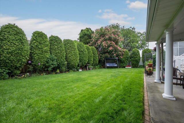 251 N Idaho Ave, Massapequa, NY 11758 - view of green lawn featuring a patio