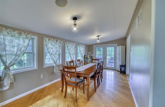 1547 Rte 208, Washingtonville, NY 10992 - dining space featuring baseboards, french doors, light wood finished floors, lofted ceiling, and a wood stove