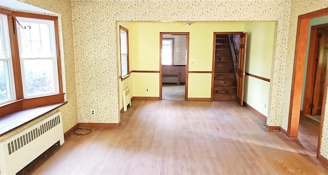 233 Peaceable Hill Rd, Brewster, NY 10509 - unfurnished room with radiator heating unit, wood finished floors, baseboards, and wallpapered walls
