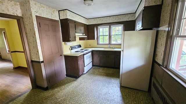 233 Peaceable Hill Rd, Brewster, NY 10509 - kitchen with white appliances, wallpapered walls, under cabinet range hood, a sink, and healthy amount of natural light