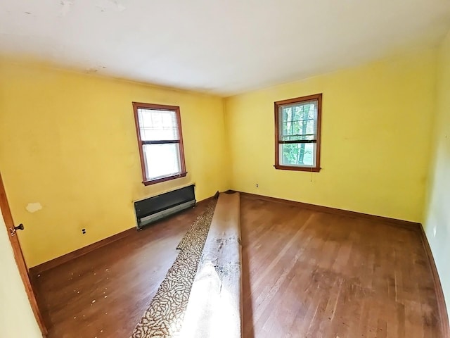 233 Peaceable Hill Rd, Brewster, NY 10509 - spare room featuring plenty of natural light, wood-type flooring, and baseboards