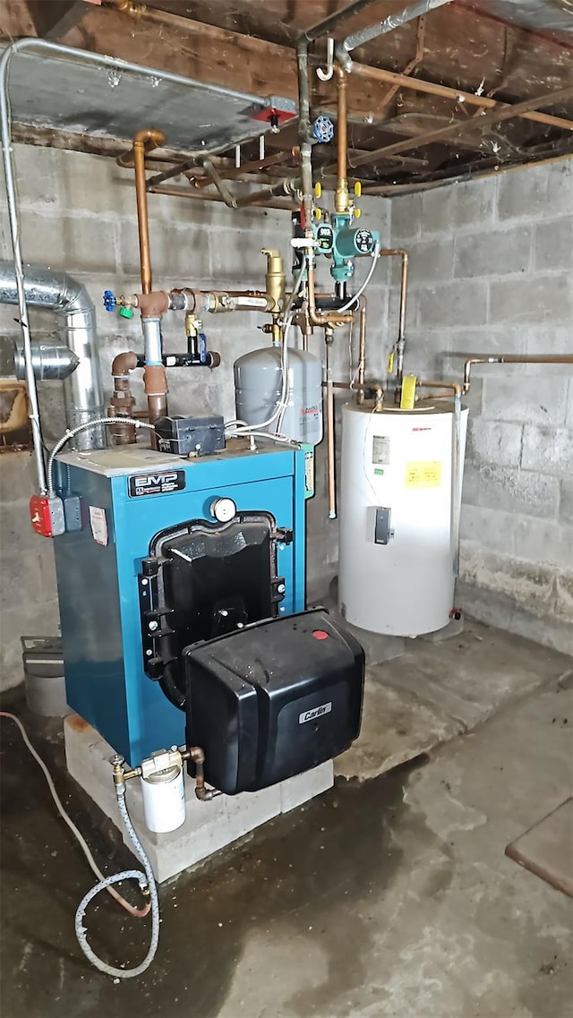 233 Peaceable Hill Rd, Brewster, NY 10509 - utility room with water heater and a heating unit