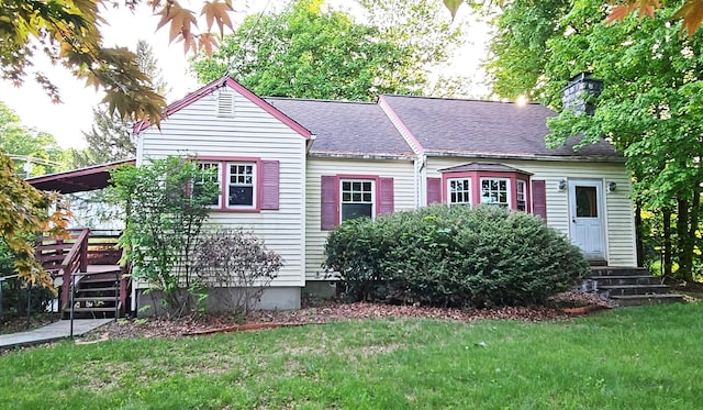 233 Peaceable Hill Rd, Brewster, NY 10509 - view of front of house featuring a front lawn, a chimney, roof with shingles, and a wooden deck