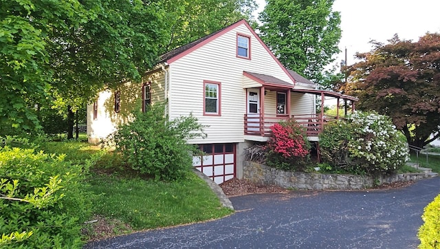 233 Peaceable Hill Rd, Brewster, NY 10509 - view of front of home featuring driveway and a garage