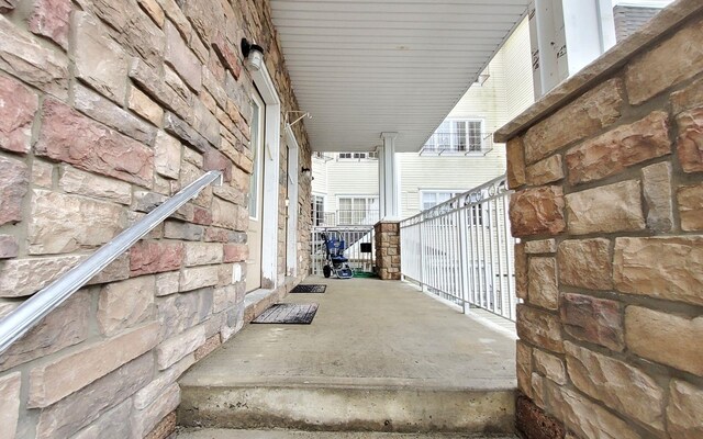 8 Lemberg Ct Unit 302, Monroe, NY 10950 - view of patio featuring a porch