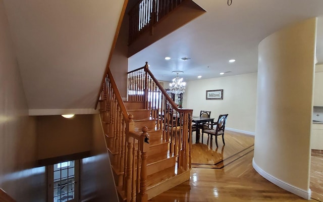 8 Lemberg Ct Unit 302, Monroe, NY 10950 - stairs with baseboards, a chandelier, recessed lighting, and wood finished floors