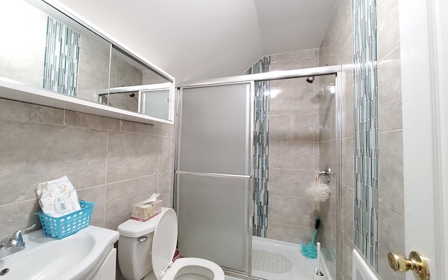 8 Lemberg Ct Unit 302, Monroe, NY 10950 - full bathroom with a sink, a stall shower, toilet, vaulted ceiling, and tile walls