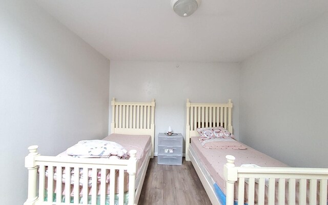 8 Lemberg Ct Unit 302, Monroe, NY 10950 - bedroom featuring dark wood finished floors
