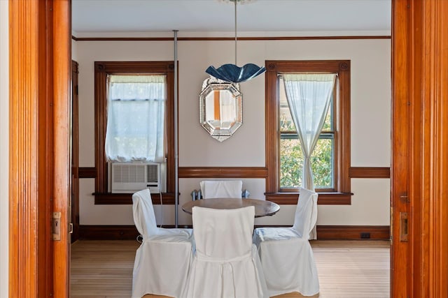 604 Main St, Greenport, NY 11944 - dining room featuring wood finished floors, baseboards, and cooling unit