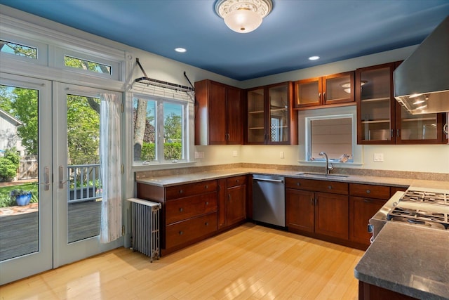 604 Main St, Greenport, NY 11944 - kitchen with dishwasher, a sink, radiator heating unit, extractor fan, and light wood-style floors