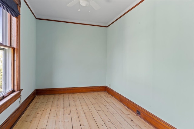 604 Main St, Greenport, NY 11944 - empty room with ornamental molding, ceiling fan, light wood finished floors, and baseboards