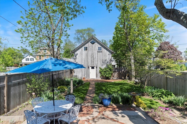 604 Main St, Greenport, NY 11944 - fenced backyard featuring a patio area and outdoor dining space
