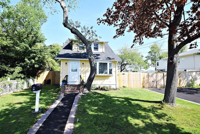 bungalow featuring roof with shingles