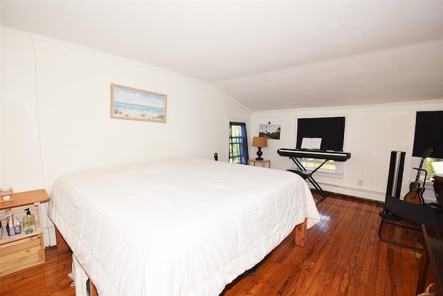 bedroom featuring a baseboard heating unit, crown molding, lofted ceiling, and wood-type flooring