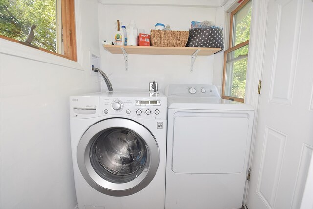 laundry area with separate washer and dryer