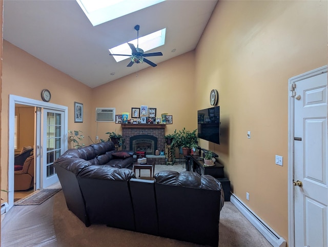 carpeted living room with a baseboard heating unit, a wall unit AC, a skylight, high vaulted ceiling, and a brick fireplace