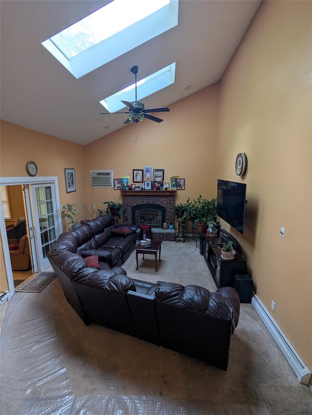 living room with a skylight, lofted ceiling, carpet floors, a fireplace, and a wall mounted AC