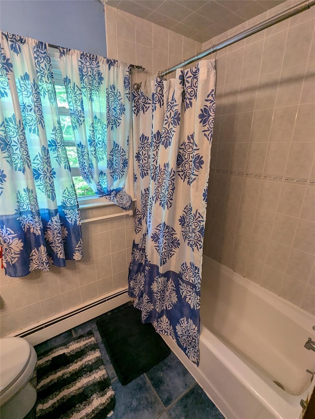 full bathroom with a baseboard radiator, toilet, shower / tub combo, and tile walls